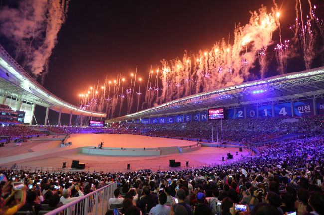 Fireworks rise over the opening ceremony of the Asian Games at the Incheon Asiad Main Stadium on Friday.   Yonhap
