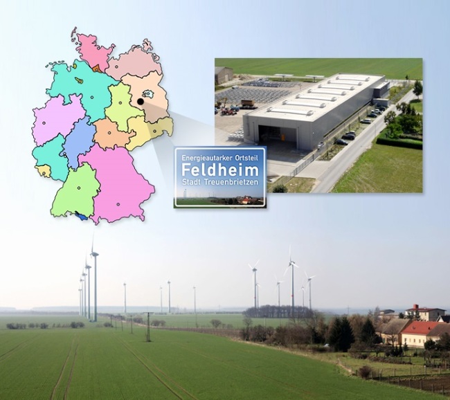A wind power plant and energy storage system (upper right) developed by Energiequelle in Feldheim, Brandenburg, Germany.   LG Chem