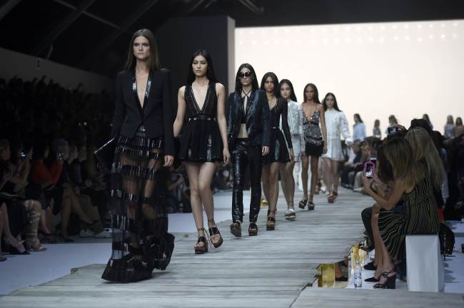 Models present creations from the Roberto Cavalli collection during the 2015 Spring-Summer Milan Fashion Week on Saturday in Milan.    AFP-Yonhap