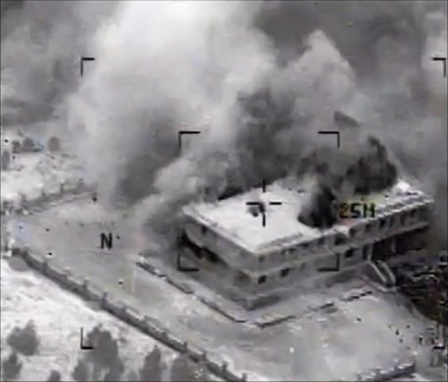 This still image made from video released by the U.S. Central Command shows a structure in Tall Al Qitar, Syria moments after a U.S. airstrike, Tuesday.   AP-Yonhap