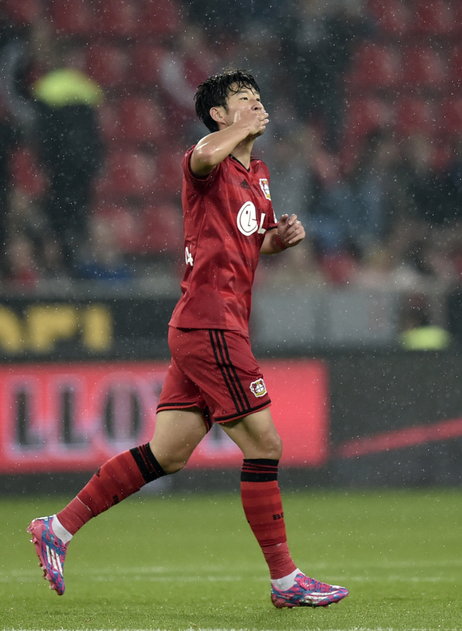 Leverkusen’s Son Heung-min celebrates after scoring the opening goal on Wednesday.   AP-Yonhap