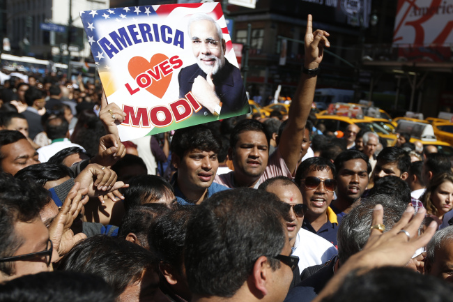Supporters of Indian Prime Minister Narendra Modi crowd the streets outside Madison Square Garden in New York after Modi gave a speech there during a reception by the Indian community in honor of his visit to the United States on Sunday.   AP-Yonhap