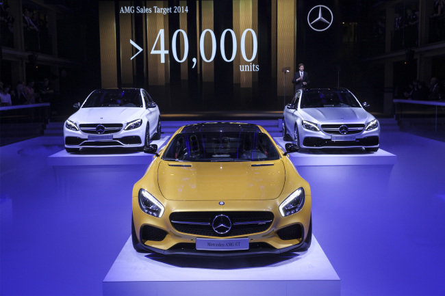 New Mercedes automobiles including the Mercedes-AMG GT (center), and Mercedes-AMG C63 automobiles stand on display during a presentation at the Mercedes-Benz AG media night at the Piscine Molitor prior to the opening of the Paris Motor Show in Paris, France, on Oct. 1.   Bloomberg