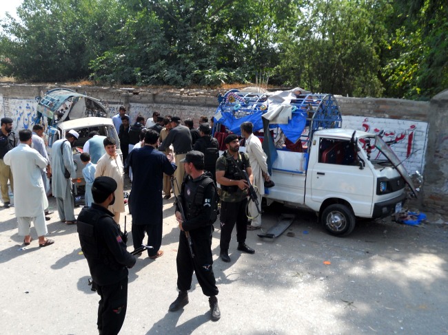 Police inspect the blast site in northwest Pakistan’s Kohat on Saturday.   Xinhua-Yonhap