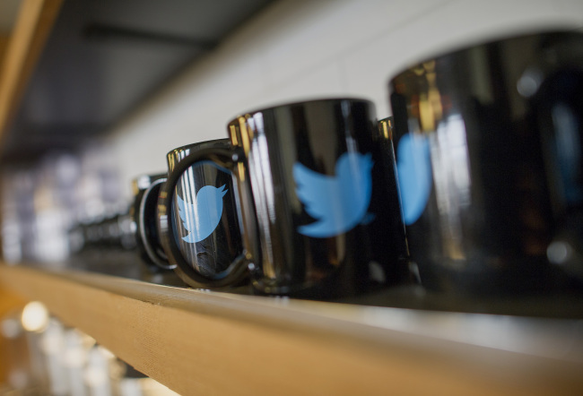 The Twitter logo is seen on coffee mugs inside the company’s headquarters in San Francisco, California.   Bloomberg
