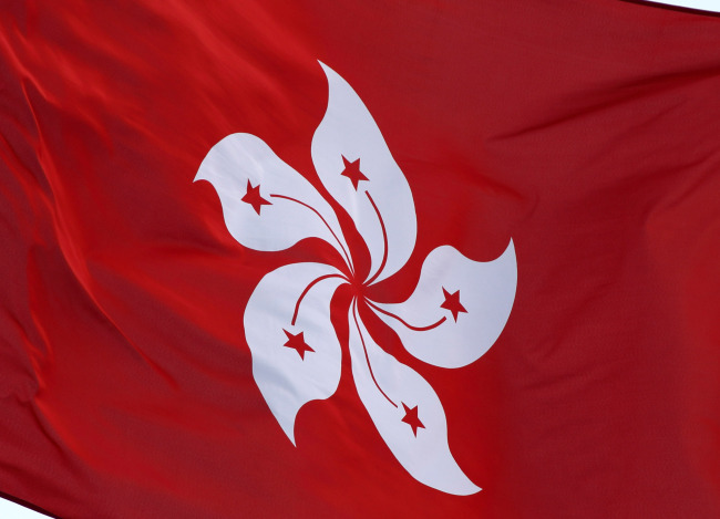 The flag of Hong Kong flies outside the Central Government Offices in Hong Kong, China, on Sunday, Oct. 5, 2014. Hong Kong Chief Executive Leung Chun-ying set a Monday deadline for opening access to government offices barricaded this week by pro-democracy protesters, raising the possibility of further clashes. Photographer: Tomohiro Ohsumi/Bloomberg
The flag of Hong Kong flies outside the Central Government Offices in Hong Kong, China, on Sunday, Oct. 5, 2014. Hong Kong Chief Executive Leung Chun-ying set a Monday deadline for opening access to government offices barricaded this week by pro-democracy protesters, raising the possibility of further clashes. Photographer: Tomohiro Ohsumi/Bloomberg