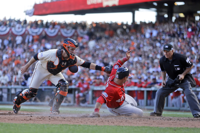 <YONHAP PHOTO-0343> Washington Nationals Wilson Ramos (40) scores past the tag of San Francisco Giants catcher Buster Posey in the seventh inning during Game 3 of baseball's NL Division Series in San Francisco, Monday, Oct. 6, 2014. (AP Photo/Ben Margot)/2014-10-07 08:41:32/ <저작권자 ⓒ 1980-2014 ㈜연합뉴스. 무단 전재 재배포 금지.>
Washington Nationals catcher Wilson Ramos scores a run in the seventh inning on Monday.   AP-Yonhap