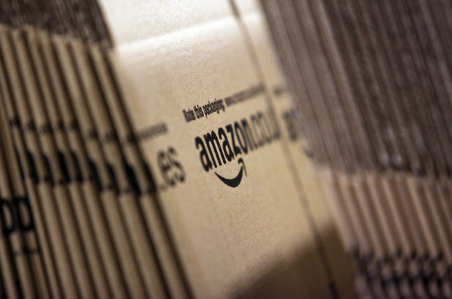 Amazon branded cardboard boxes sit stacked in Ridgmont, England.  Bloomberg
Amazon branded cardboard boxes sit stacked in Ridgmont, England.  Bloomberg