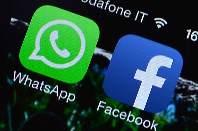 The Facebook and WhatsApp applications’ icons are displayed on a smartphone.   AFP-Yonhap