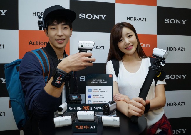 Models pose with Sony’s new action camera the AZ1 in Seoul on Tuesday.   Sony Korea