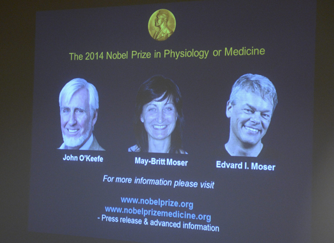 Images of the winners of the 2014 Nobel Prize for Medicine are projected on a screen during the announcement in Stockholm on Monday.   AP-Yonhap