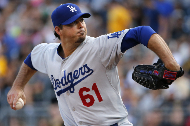 <YONHAP PHOTO-0252> FILE - In this July 22, 2014, file photo, Los Angeles Dodgers starting pitcher Josh Beckett (61) delivers during the first inning of a baseball game against the Pittsburgh Pirates in Pittsburgh. Beckett, facing surgery for a torn labrum in his left hip that caused him to miss most of the last three months of the season, has retired at 34, ending a 14-year career that included two World Series championships. He announced his decision to retire in St. Louis after the Dodgers were eliminated in the National League Division Series on Tuesday night, Oct. 7, 2014, according to MLB.com. (AP Photo/File)/2014-10-09 05:51:44/ <저작권자 ⓒ 1980-2014 ㈜연합뉴스. 무단 전재 재배포 금지.>
Los Angeles Dodgers starting pitcher Josh Beckett has retired at age 34, ending a 14-year career that included two World Series championships.   AP-Yonhap