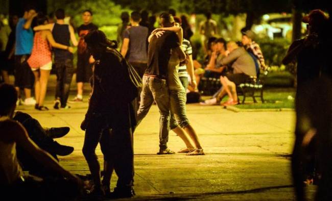 Cuban youngsters enjoy the park at G street in Havana, a longtime meeting place of young urban tribes.   AFP