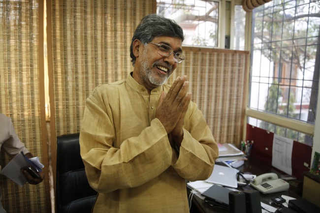 Indian children’s rights activist Kailash Satyarthi gestures as he addresses the media at his office in New Delhi on Friday.   AP-Yonhap