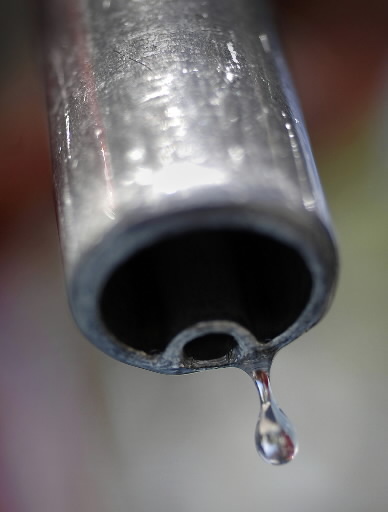 A gas pump nozzle at a gas station in Sydney.   Bloomberg