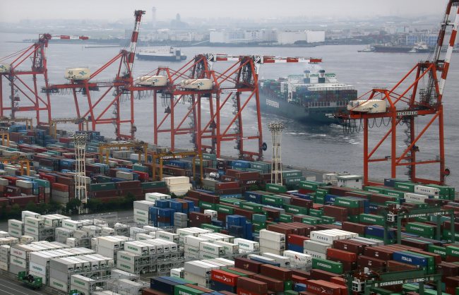 A cargo vessel leaves the port at Aomi international container terminal in Tokyo.   EPA-Yonhap