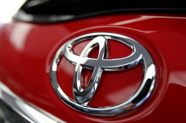 The Toyota Motor logo is displayed on an automobile at the company’s headquarters in Tokyo.   Bloomberg