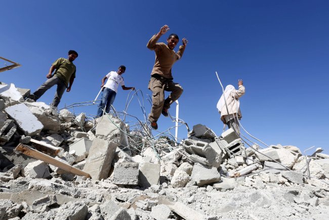 A Palestinian jumps from the rubble of his home in the village of Um Alkhier, near the Jewish settlement of Kamel and south of the West Bank city of Hebron, after the dwelling was demolished by Israeli security forces Monday.   EPA-Yonhap