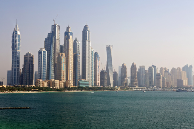 City skyscrapers stand on the waterfront in Dubai.   Bloomberg
City skyscrapers stand on the waterfront in Dubai.   Bloomberg