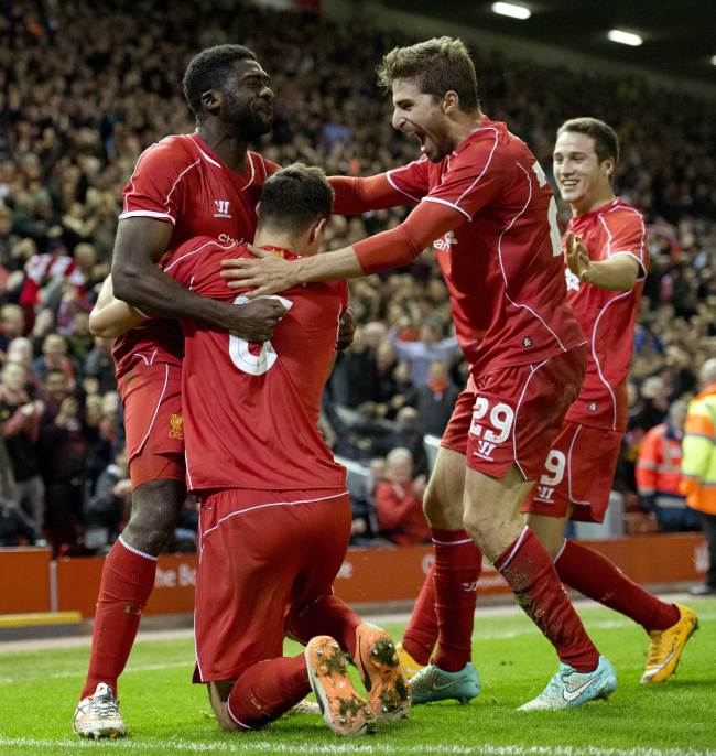 Liverpool’s defender Dejan Lovren (center) celebrates scoring his team’s second goal with teammates on Tuesday (AFP-Yonhap)