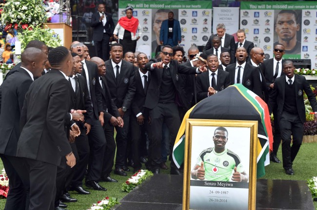 Team members of the Orlando Pirates pay thier last respect to Senzo Meyiwa during the funeral of Senzo Meyiwa at Moses Mabhida Stadium in Durban, South Africa, Saturday.   Xinhua-Yonhap