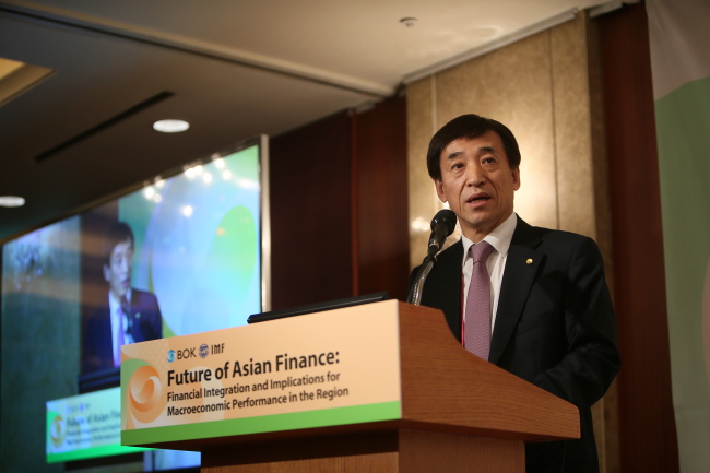 Bank of Korea Gov. Lee Ju-yeol delivers the opening speech at the BOK-IMF joint conference held Monday at Lotte Hotel Seoul.    Bank of Korea