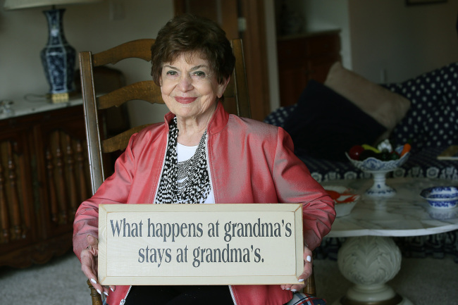 Gretta Freeman, 85, holds one of her favorite signs inside her home in St. Louis Park, Minnesota, on Oct. 17. (Minneapolis Star Tribune/MCT)