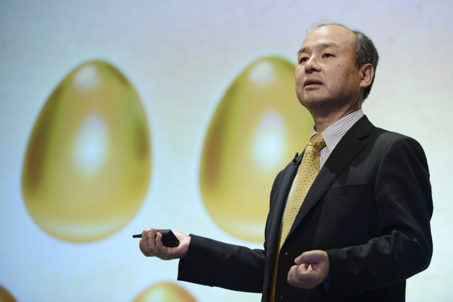 Billionaire Masayoshi Son, chairman and chief executive officer of  SoftBank Corp., speaks during a news conference in Tokyo on Tuesday.   Bloomberg