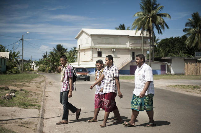 Youngsters cross a street in Mata-Utu, the capital of French overseas territory of Wallis and Futuna, in the Pacific Ocean. (AFP)