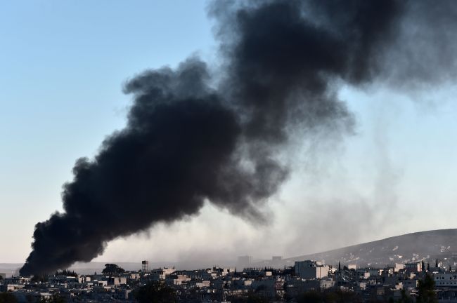Smoke rises after an airstrike from US-led coalition against IS militants in the Syrian town of Kobane (AFP)