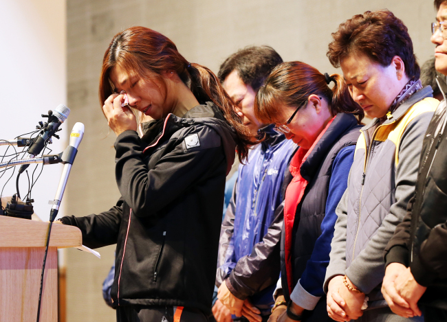 A representative of the families of those still missing from the April 16 Sewol ferry accident speaks during a press conference on Tuesday after government officials announced the end of salvage operations.   Yonhap