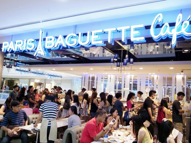 Customers shop at SPC Group’s Paris Baguette outlet in Singapore.   SPC Group
