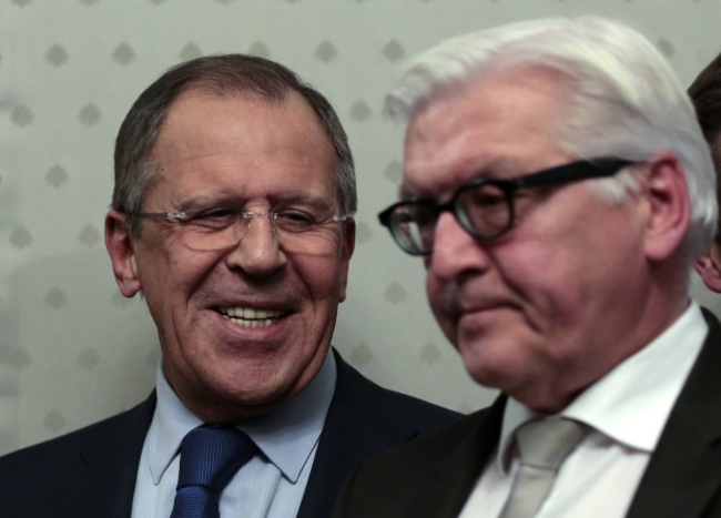 Russian Foreign Minister Sergey Lavrov (left) smiles at German Foreign Minister Frank-Walter Steinmeier as they leave a news conference in Moscow on Tuesday.   AP-Yonhap
