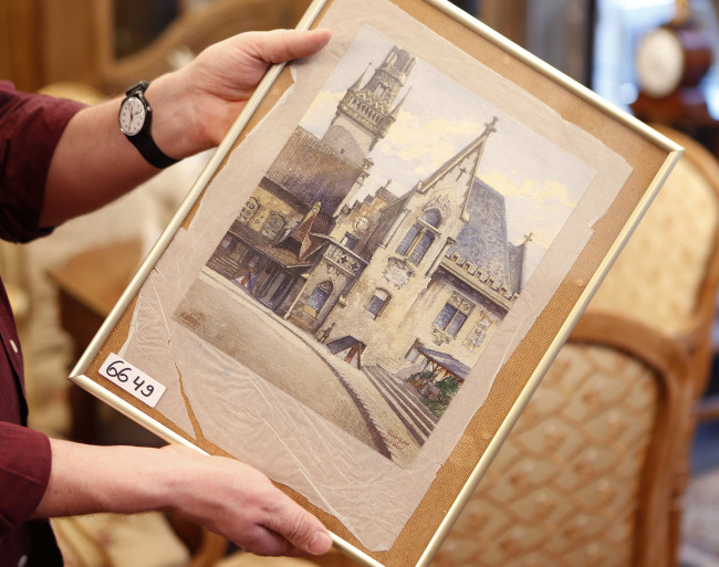 A painting titled “The Old City Hall” by Adolf Hitler is displayed in an auction house in Nuremberg, Germany.   AP-Yonhap