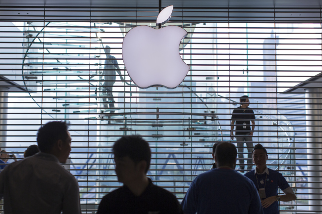 The Apple logo is displayed at one of the company’s stores in Hong Kong.   Bloomberg