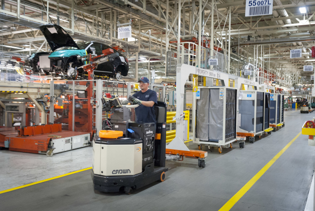 A material handling associate drives a hydrogen-powered vehicle at the plant. BMW Group