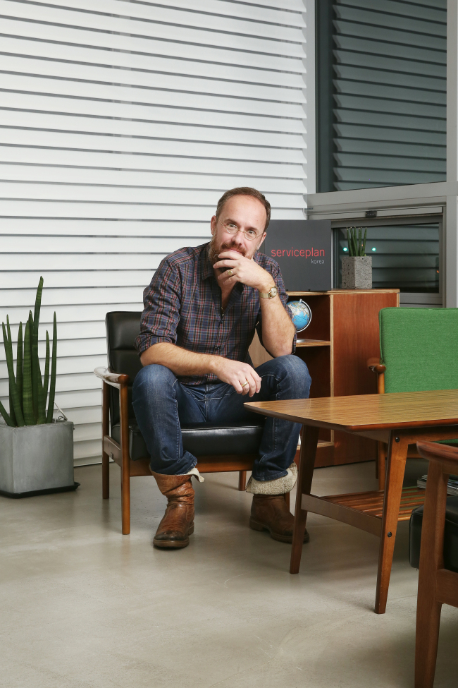 Alex Schill, global chief creative officer and partner of Serviceplan Group, poses before an interview with The Korea Herald on Monday.   Serviceplan Korea