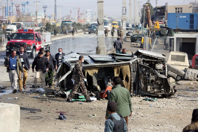 Afghan security forces inspect a British Embassy vehicle which was targeted in a suicide attack in Kabul on Thursday.  AP-Yonhap