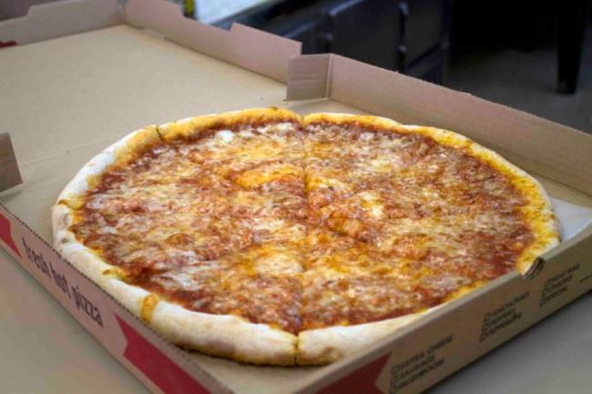 A cheese pizza from Espresso Pizza on Main Street in Nashua, New Hampshire.   AP