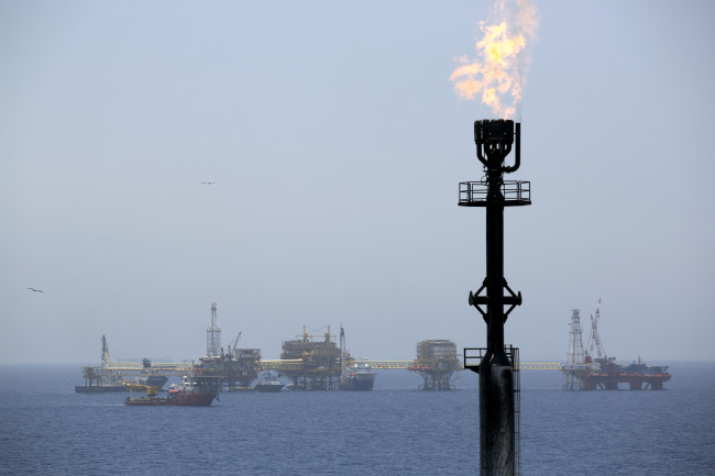 Gas is flared from a tower on an oil drilling rig operated by Petroleos Mexicans in the Ku-Maloob-Zaap oilfield at Campeche Bay off the coast of Ciudad del Carmen, Mexico.   Bloomberg