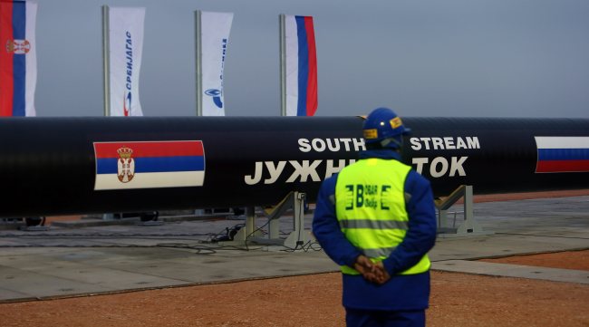 A worker stands next to steel pipes during the ceremony marking the start of the construction of the South Stream gas pipeline at a field north of Belgrade, Serbia.   EPA-Yonhap
