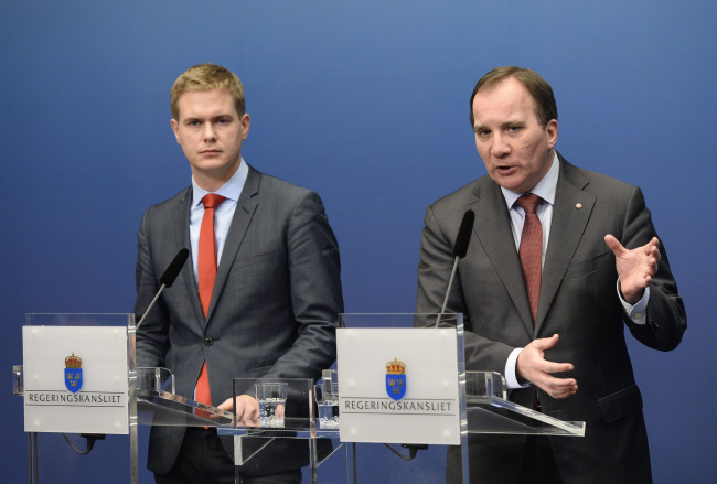 Sweden’s Prime Minister Stefan Lofven (right) of the Social Democrats and Minister of Education Gustav Fridolin of the Green Party hold a news conference at the government chancellery in Stockholm on Wednesday.   AP-Yonhap