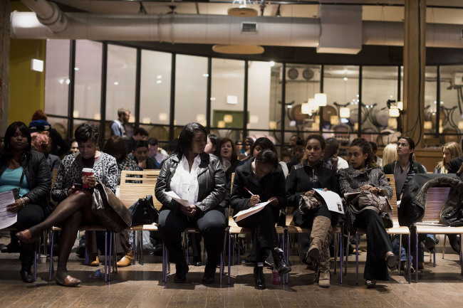 Job seekers wait to be interviewed during a Virgin Hotels job fair in Chicago, Illinois.   Bloomberg