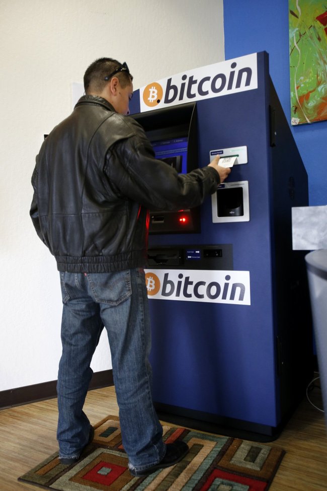 A man issues his public key from a bitcoin ATM in California.   MCT
