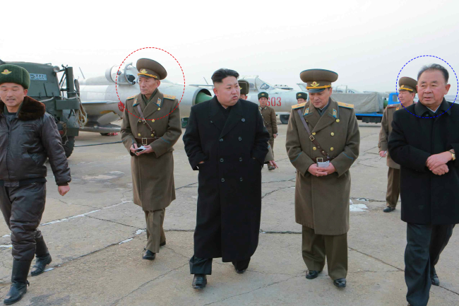 North Korean leader Kim Jong-un, with the current and former Air Force chiefs ― Choe Yong-ho (in red circle) and Ri Byong-chol (in blue circle) ― inspects an Air Force unit, the Rodong Sinmun, the daily of the North’s ruling Workers’ Party, reported Monday.   Yonhap