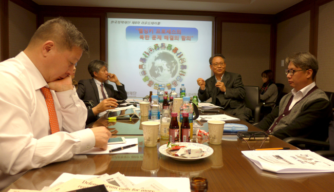 Lee In-bae (second from left), Korea Polytechnic University Gangseo Campus president and a leading authority on North Korea, gives a lecture on the Helsinki Process at the Korea Policy Foundation. (Joel Lee/The Korea Herald)