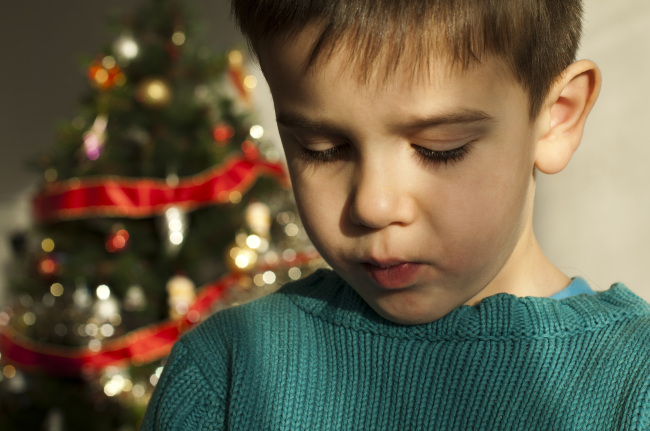When circumstances change for the worse, it’s important for parents to help their children adapt to their new world during the holiday season. (Fotolia)