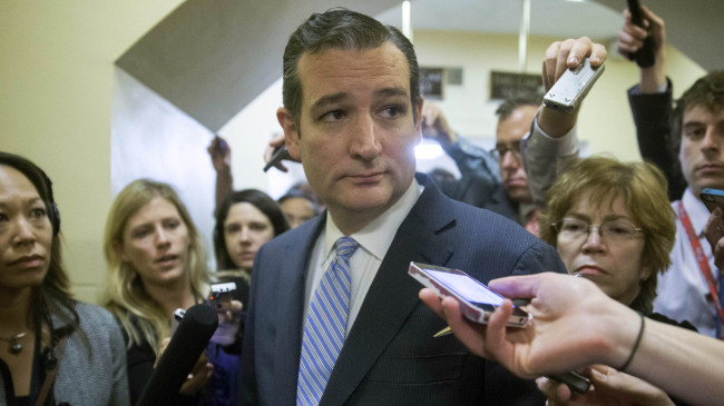 Sen. Ted Cruz, a Republican from Texas, talks to members of the media while walking through the U.S. Capitol basement in Washington, D.C., Friday.   Bloomberg