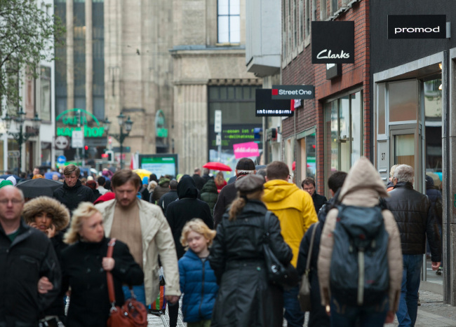 Shoppers pass stores on a pedestrianized retail street in Dusseldorf, Germany.   Bloomberg
Shoppers pass stores on a pedestrianized retail street in Dusseldorf, Germany.   Bloomberg