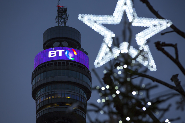 A BT logo sits behind Christmas street decorations on the BT Tower operated by BT Group Plc in London, U.K., on Monday, Dec. 15, 2014. BT started exclusive talks to acquire Deutsche Telekom AG and Orange SA's British wireless venture EE for 12.5 billion pounds ($19.6 billion), moving ahead with a deal that's set to spur more mergers in the U.K. telecommunications market. Photographer: Jason Alden/Bloomberg
The BT Tower in London   Bloomberg